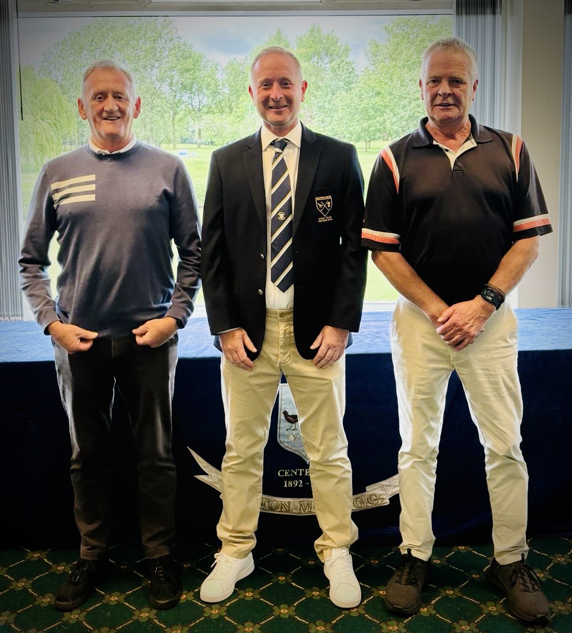 Seniors Open winners Paul Willoughby and Harry McNeil with the club captain.